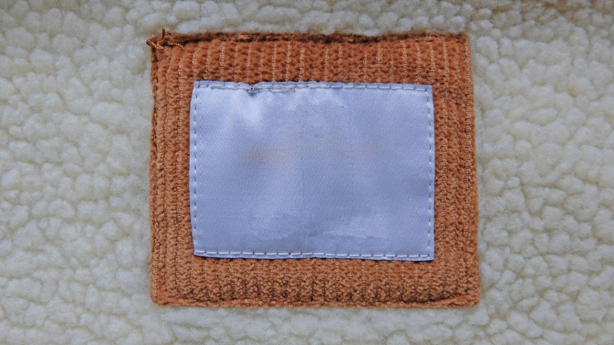 Finished embroidered patch on garment